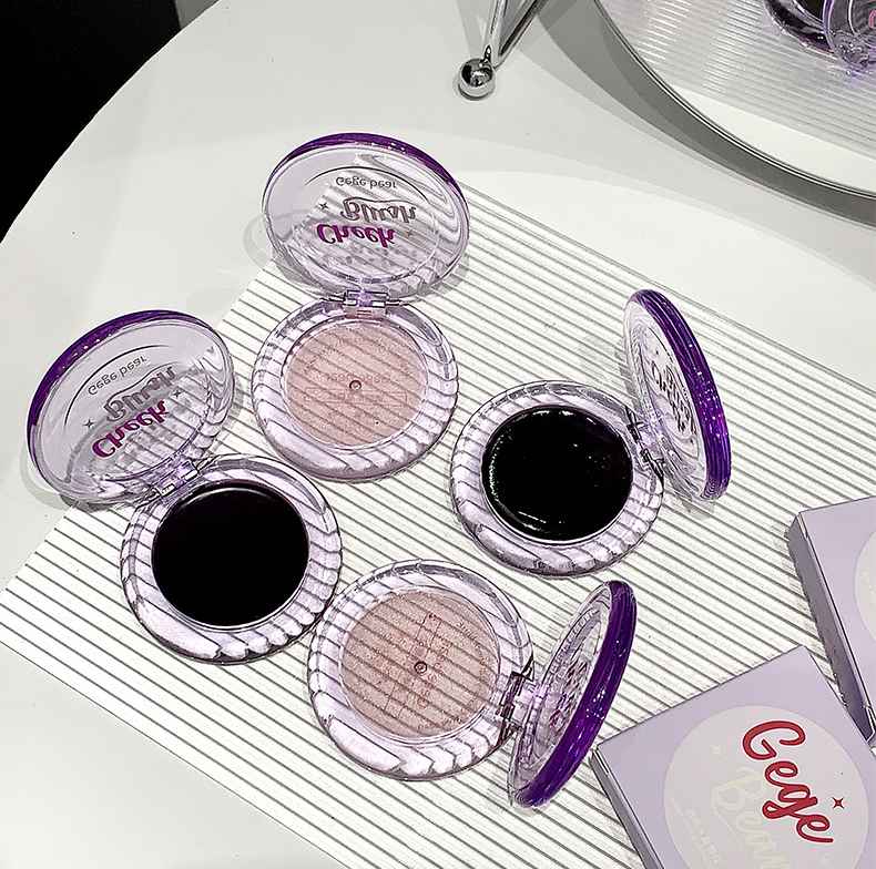 Makeup blush with visible brand on a white surface