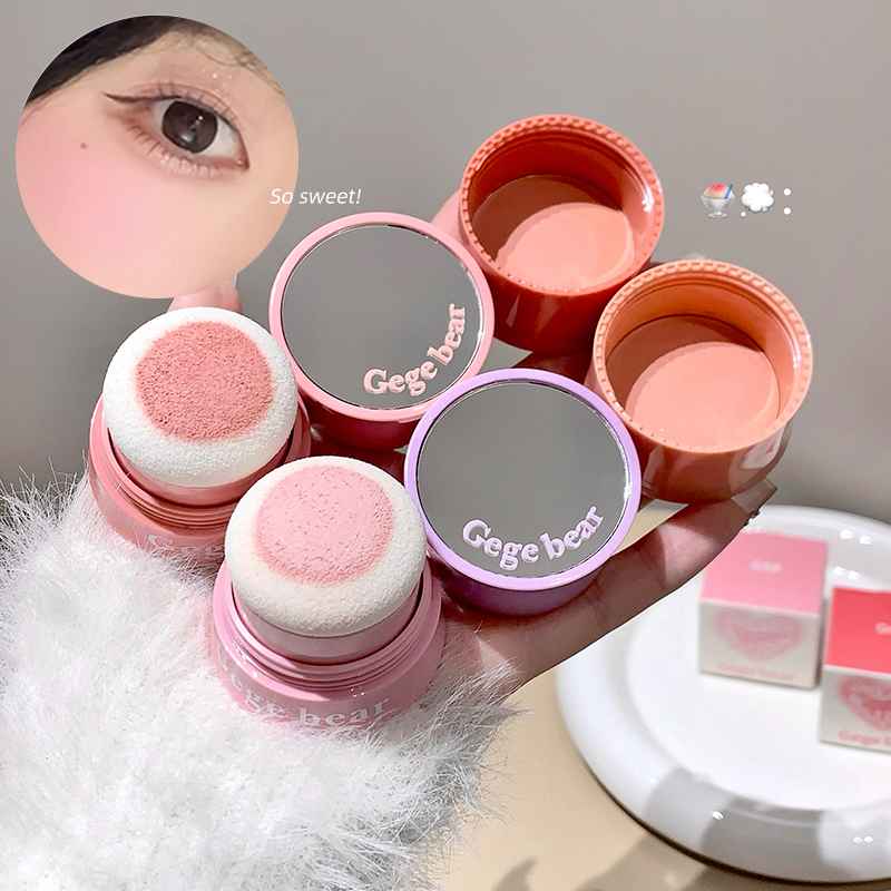 Makeup blush set with 'Gee bear' branding held by a hand.