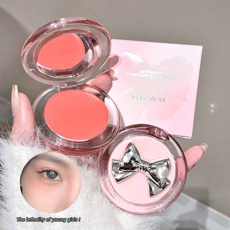 Makeup blush with a bow design on a neutral background