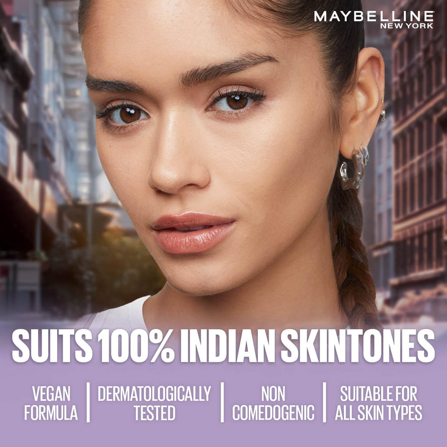 Advertisement for Maybelline New York makeup with a model against an urban background