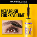 Maybelline New York mascara ad with eye and brush on yellow background