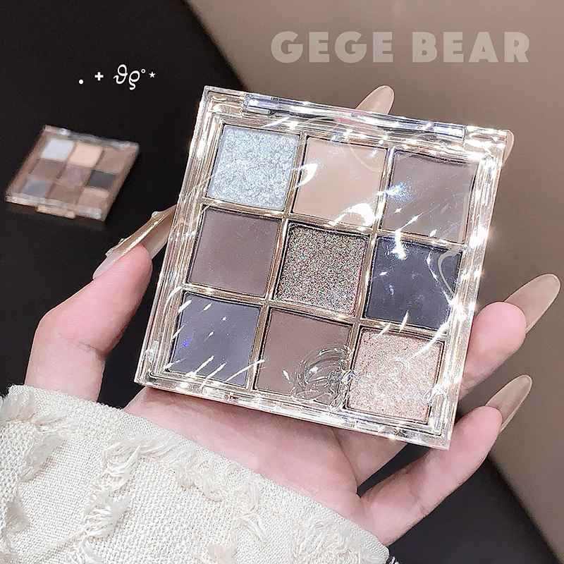 Nude Eyeshadow palette held in a hand with 'GEGE BEAR' branding showing 9 shades