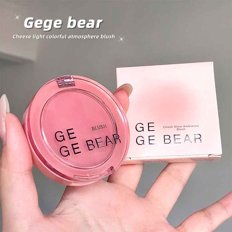 Pink blush compact with 'Gege Bear' branding held in a hand against a neutral background