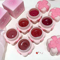 Pink blush containers with a strawberry design on a white background