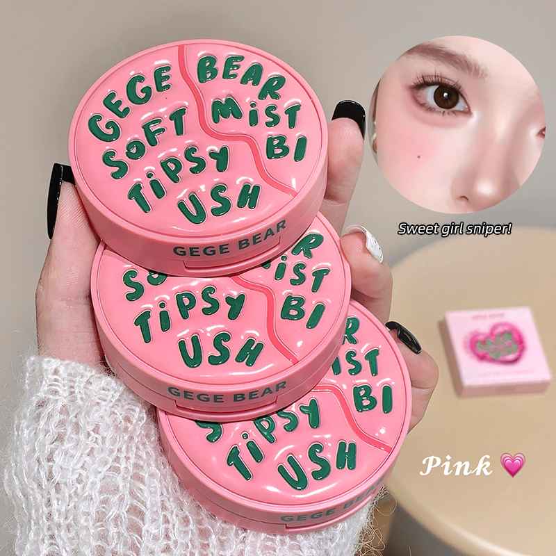 Pink blush container with text held by a hand, close-up of a person's face, and pink compact mirror on a beige surface.