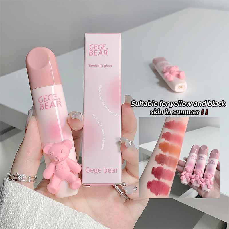 Pink lipstick with 'Gege Bear' branding held by a hand, with packaging and color swatches displayed.