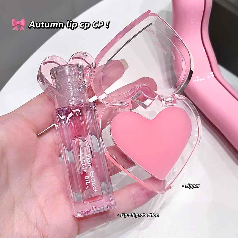 Pink lipstick with heart-shaped case held in a hand, brand 'Autumn lip cp GP' visible.