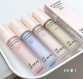 Set of GE BEAR concealer bottles on a tray with a box in the background.