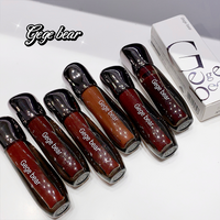 Set of Gege bear lip glosses with packaging on a white background