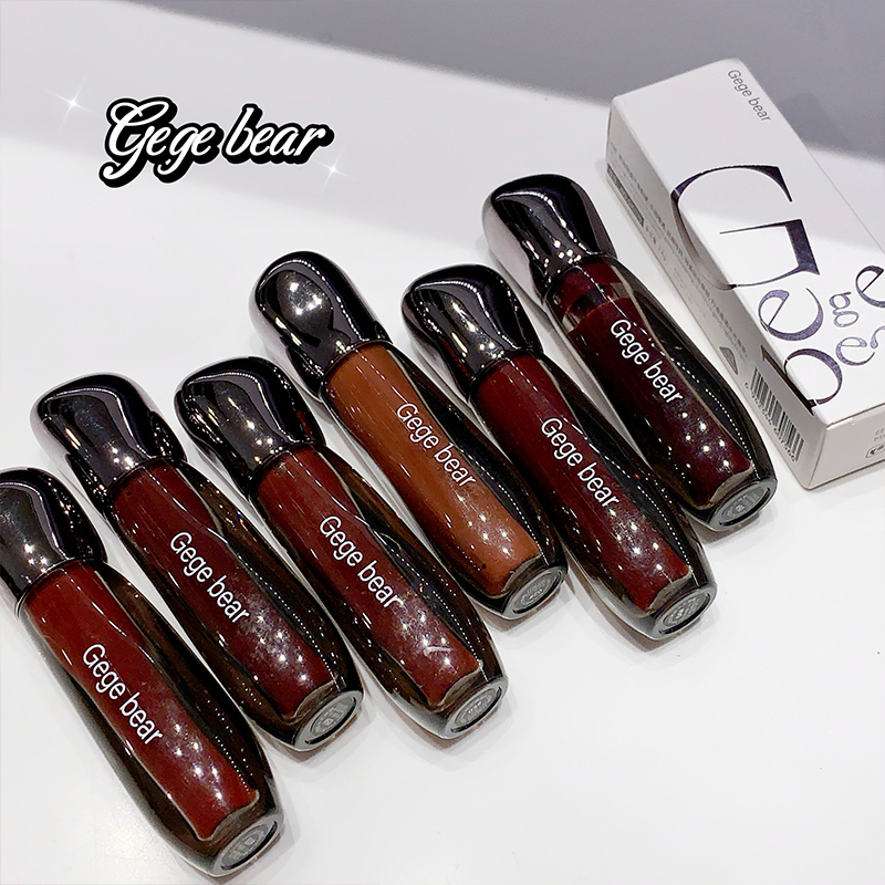 Set of Gege bear lip glosses with packaging on a white background