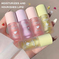 Six lip lip gloss with 'Gege bear' branding on a hand against a neutral background. Showing all three flavours 