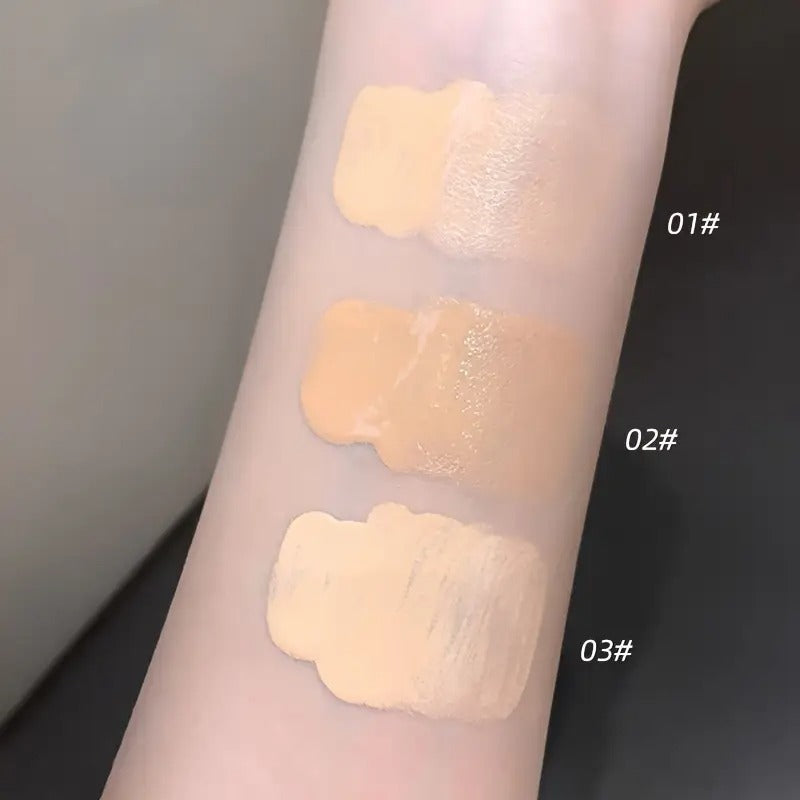 Swatches of a foundation on a person's arm with labels '01#', '02#', and '03#' against a neutral background.