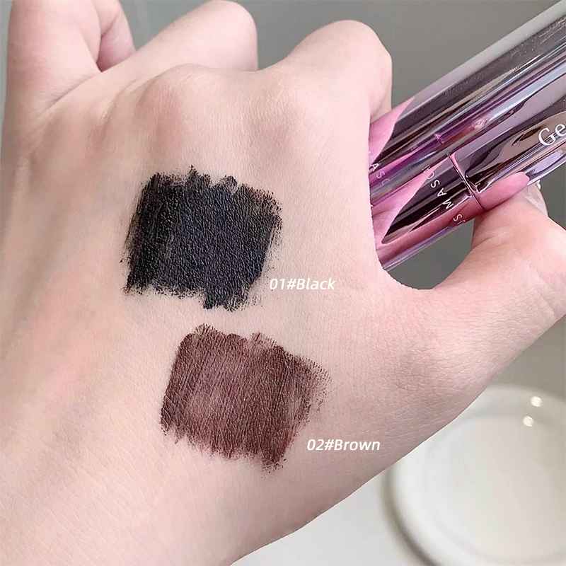 Hand holding two makeup swatches labeled '01#Black' and '02#Brown' with a makeup product.