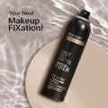 Black bottle of swiss beauty setting spray on gray background.