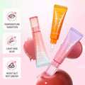 Three lip gloss tubes in different colors on a pink background with text about product features.