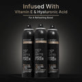 Image of three setting spray bottle on gray and black background.