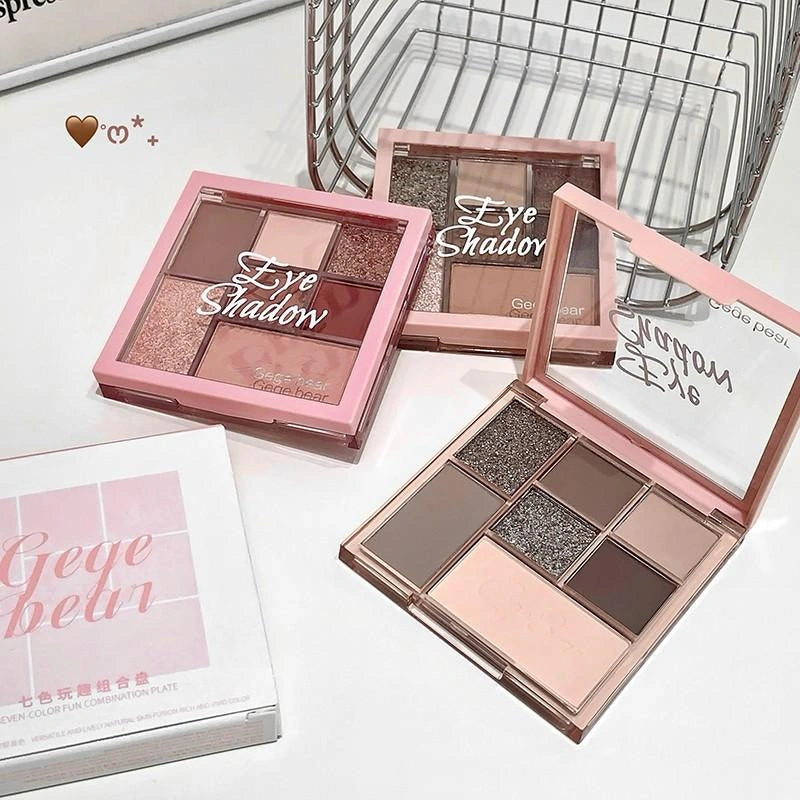 Makeup eye shadow palettes with 'Geye belvin' branding on a white surface.