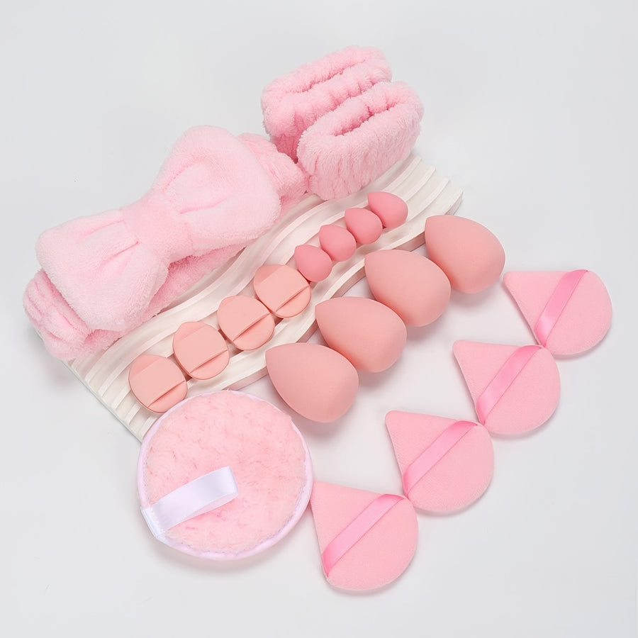 baby pink set of beauty blender kit on a tray on a while backgroud beautifully laid out 