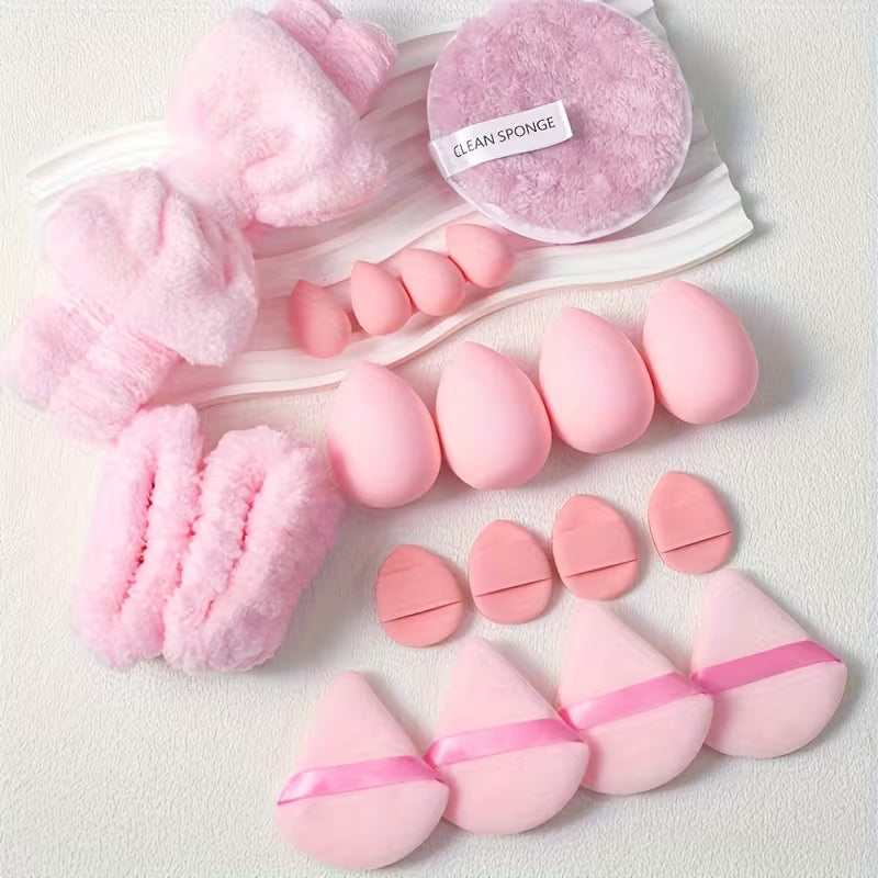baby pink beauty blender set of 20 pieces on a tray against white grainy surface 