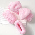 baby pink makeup headbands and wristbands for spa on a tray against the white grainy backgrond 