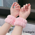 pair of baby pink wristbands on a the hands of a lady