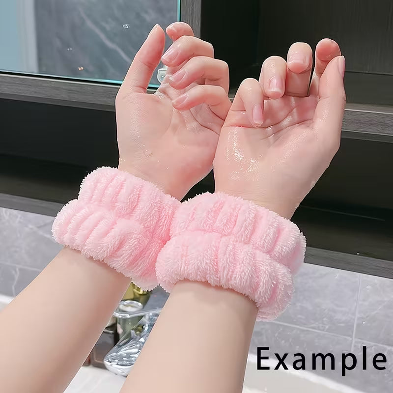 pair of baby pink wristbands on a the hands of a lady