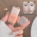 Hand holding a cosmetic bottle with 'Gege bear' branding, showing a 'before' and 'after' comparison of skin on a blurred background.