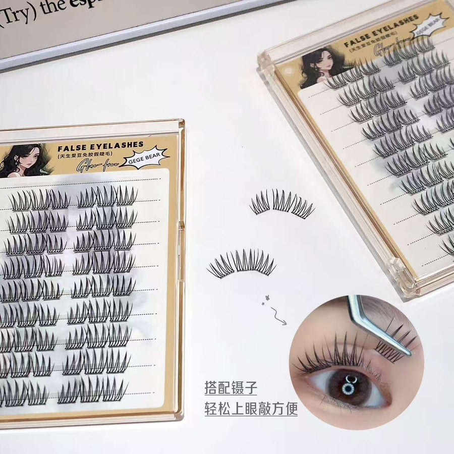 False eyelashes set with packaging and an inset showing application on an eye.