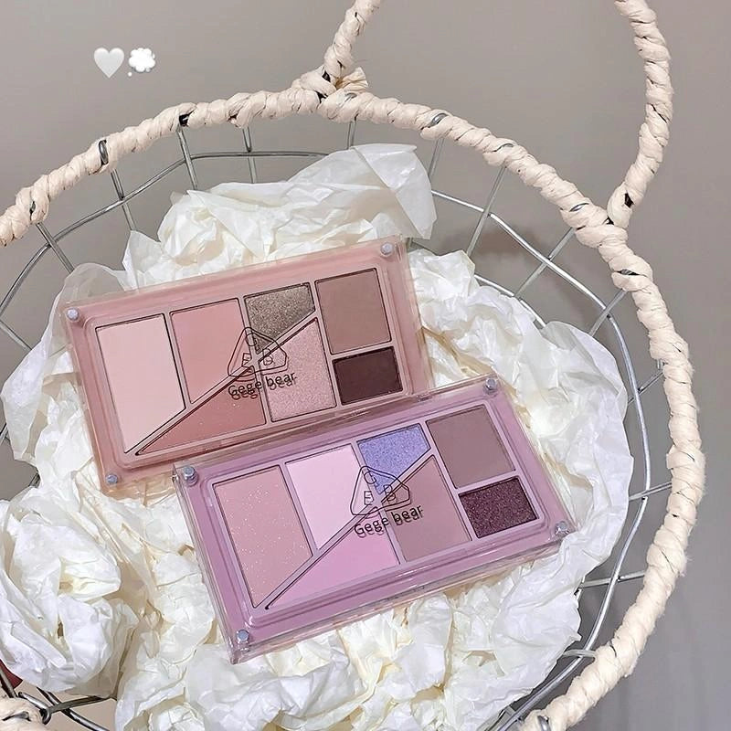 Makeup palettes with a gege bear brand logo on a decorative background