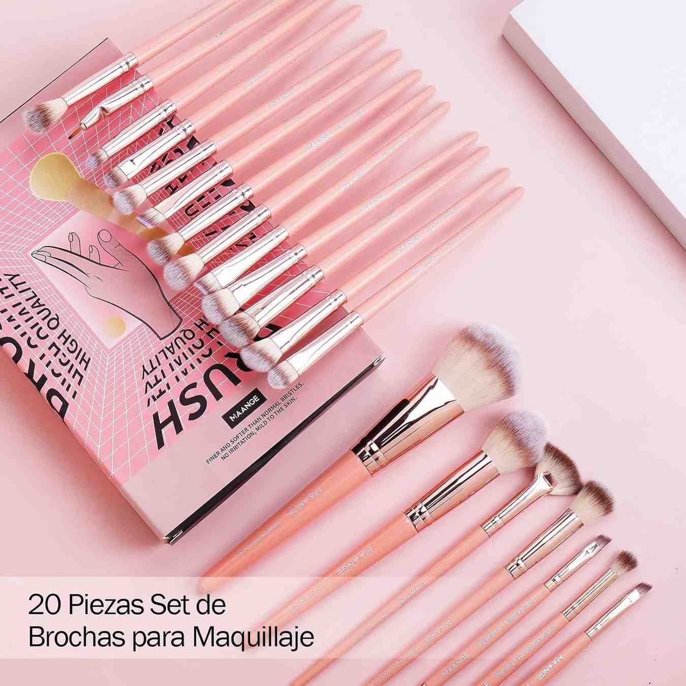 Set of makeup brushes with a pink and gold design on a matching pink background.