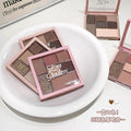 Makeup eyeshadow palettes on a white plate with visible brand name.