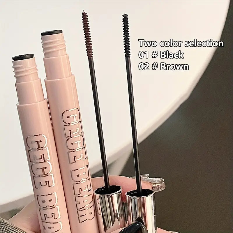 Two mascaras with black and brown tips on a light background