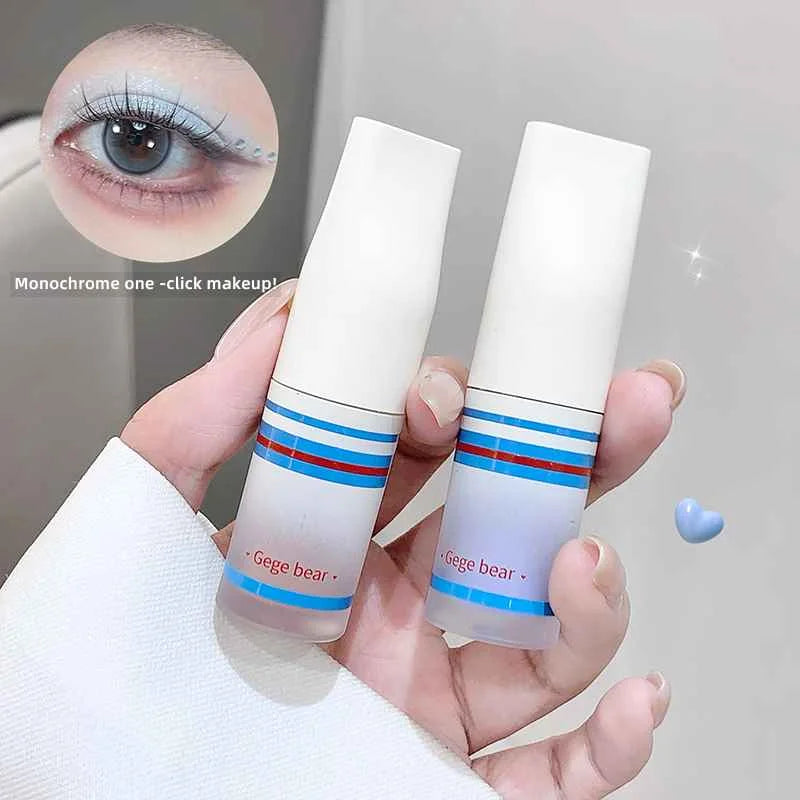 Two Gege bear eyeshadow held by a hand with an inset of an eye wearing makeup.