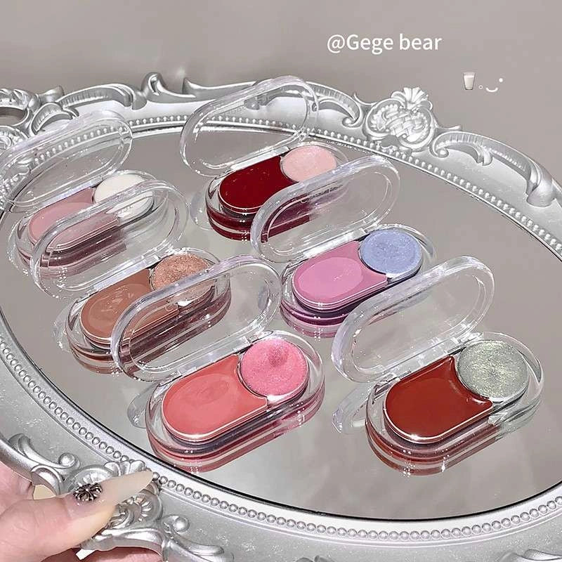 Set of small makeup blush palette with highlighter products on a decorative tray.