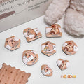 brown beauty blender set of 8 laid out on the table beside furry teddy bear 
