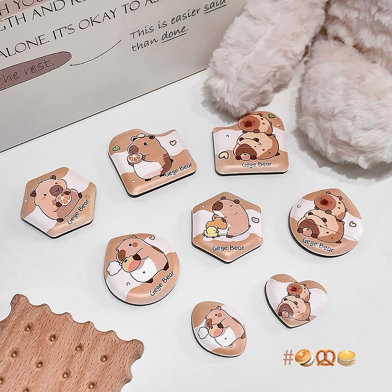 brown beauty blender set of 8 laid out on the table beside furry teddy bear 