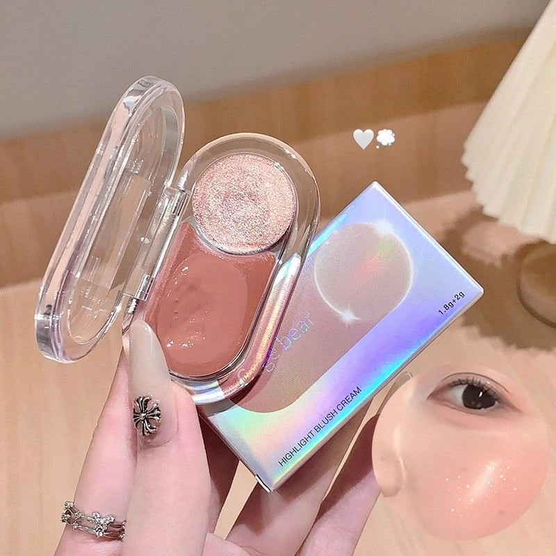 gege bear blush with highlighter cake held by a hand, close-up of blush on cheek.