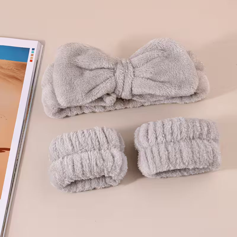 pair of brown headband and wristbands on a grey background and magazin as props 