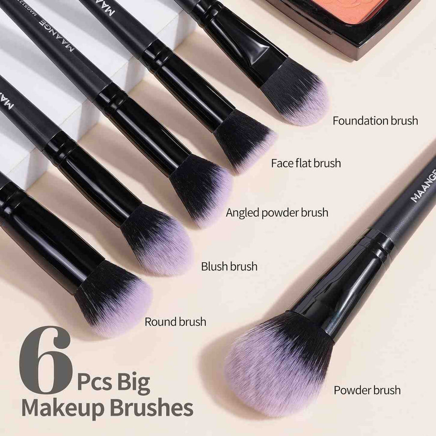 Set of 6 makeup brushes with labels on a beige background