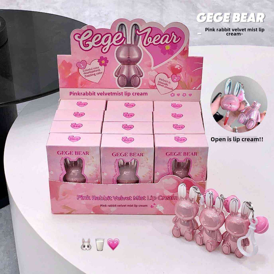 Display of pink rabbit-shaped lipsticks with packaging labeled 'GEGE BEAR' on a white surface.