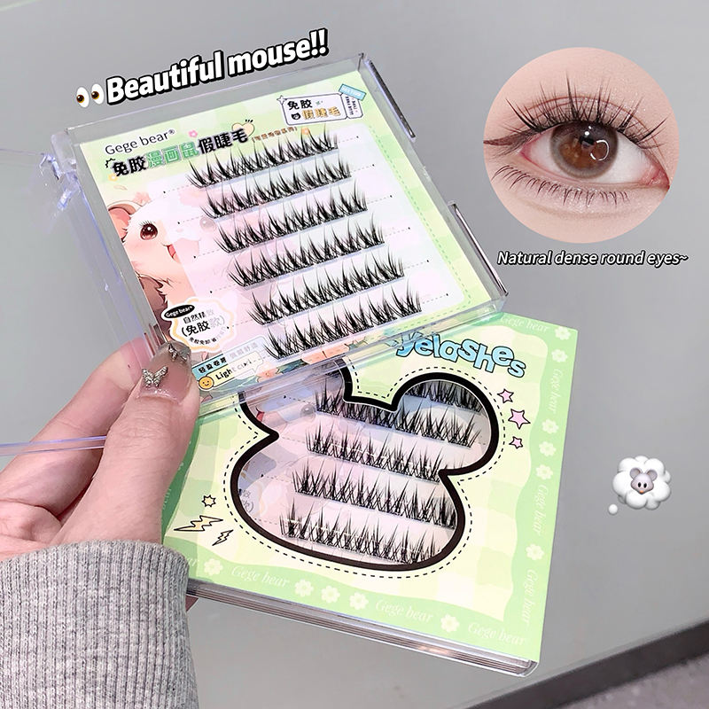 Set of false eyelashes with a box labeled 'Gege bear' on a green background.