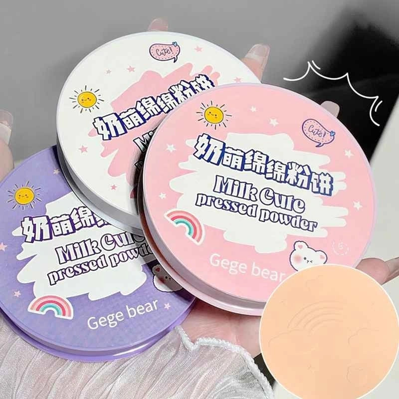 pack of 3 compact pressed powder in pink, white and purple color on the hand of a lady 