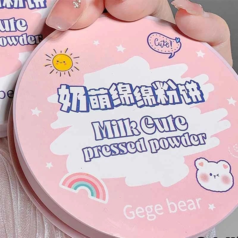 Pink compact powder case with 'Milk Cute' branding and cartoon designs.