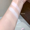 Three swatches of gege bear compact powder on a person's arm with labels indicating 'Vitality', 'Mint blue', and 'Natural'.