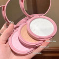 setting powders with three shades held in a hand against a neutral background