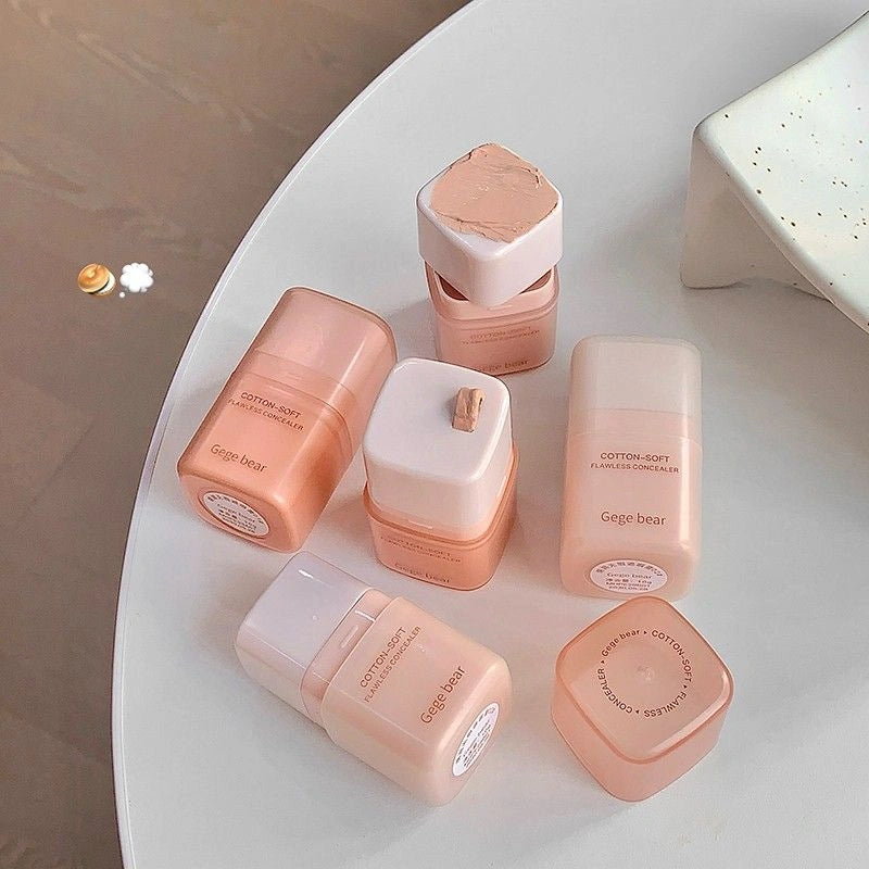 Set of Gege bear matte concealer with  dispenser bottles on a white surface