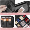 Black makeup organizer with various compartments including brush flap, smooth surface, brush pockets, and cosmetic storage.