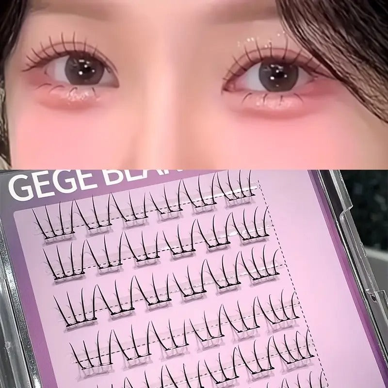False eyelashes displayed on a tray with a close-up of eyes wearing them.
