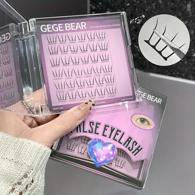False eyelashes packaging with 'GEGE BEAR' branding held by a hand.