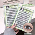 False eyelashes in packaging with a hand holding them, close-up of an eye wearing the lashes.